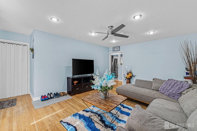 living area with recessed lighting, ceiling fan, baseboards, and hardwood / wood-style floors
