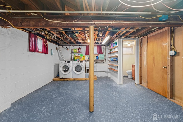 basement with washing machine and clothes dryer