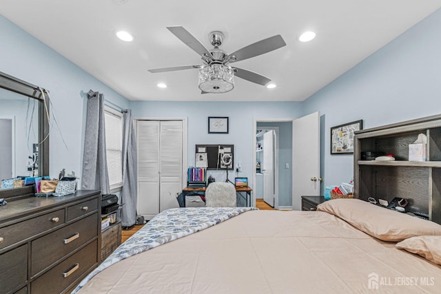 bedroom featuring ceiling fan, a closet, recessed lighting, and wood finished floors