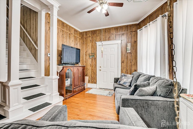 151 N Broadway N, South Amboy, NJ 08879 - living area with ceiling fan, crown molding, wood walls, light wood-type flooring, and stairway
