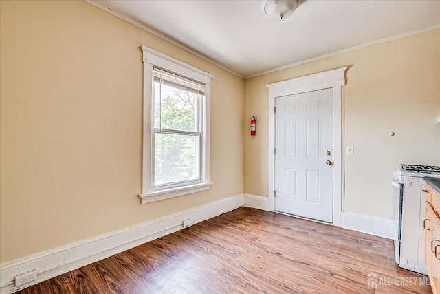 151 N Broadway N, South Amboy, NJ 08879 - foyer entrance with ornamental molding, light wood finished floors, and baseboards