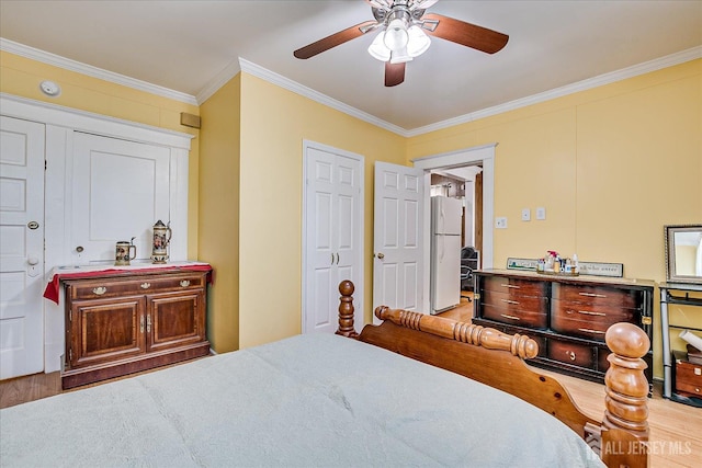 151 N Broadway N, South Amboy, NJ 08879 - bedroom featuring freestanding refrigerator, wood finished floors, ornamental molding, and a ceiling fan