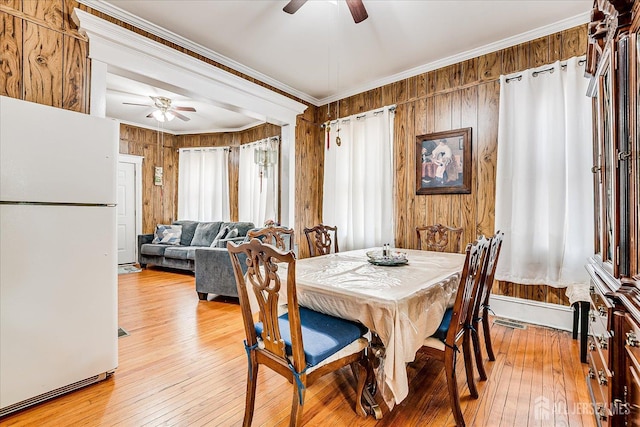 151 N Broadway N, South Amboy, NJ 08879 - dining area with ceiling fan, crown molding, light wood-style flooring, and wood walls