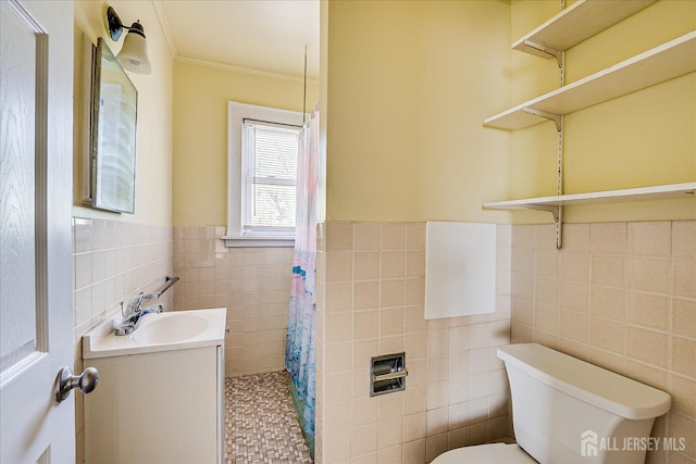 151 N Broadway N, South Amboy, NJ 08879 - bathroom featuring tile walls, toilet, vanity, tiled shower, and a wainscoted wall