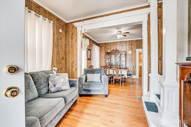 151 N Broadway N, South Amboy, NJ 08879 - living room with ornamental molding, light wood-style flooring, a ceiling fan, and wooden walls