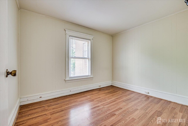 151 N Broadway N, South Amboy, NJ 08879 - spare room with light wood finished floors, crown molding, and baseboards