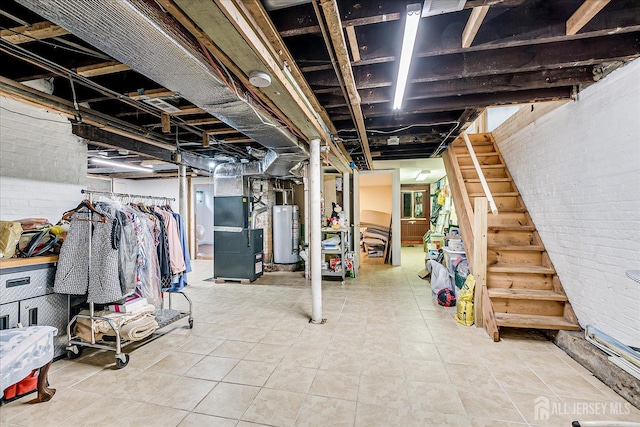 151 N Broadway N, South Amboy, NJ 08879 - unfinished basement featuring brick wall, heating unit, water heater, stairs, and tile patterned flooring