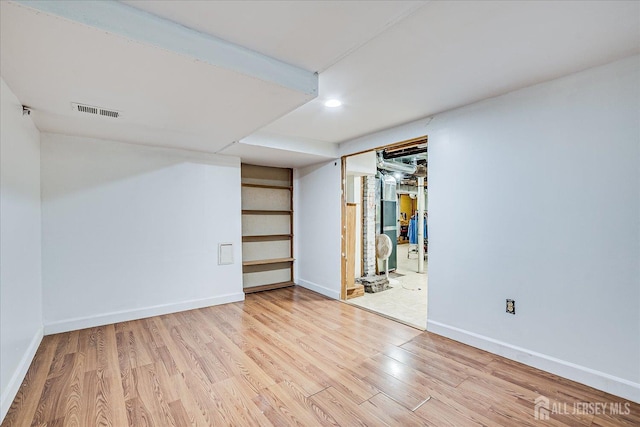 151 N Broadway N, South Amboy, NJ 08879 - finished below grade area featuring wood finished floors, baseboards, and recessed lighting