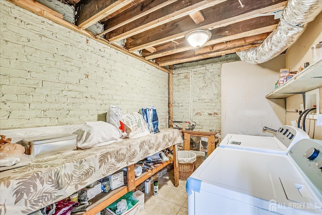 151 N Broadway N, South Amboy, NJ 08879 - washroom featuring separate washer and dryer, brick wall, and light tile patterned floors
