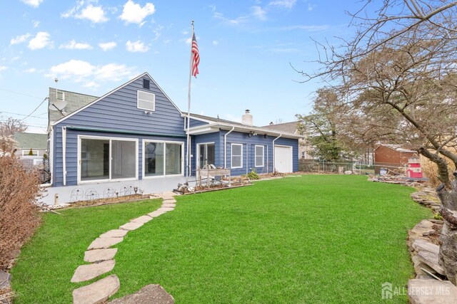 back of house featuring a yard