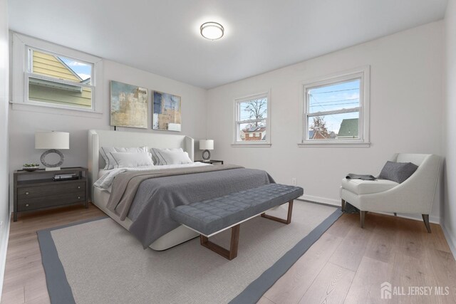 bedroom featuring light wood-type flooring