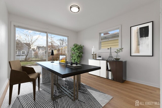 office area featuring light wood-type flooring and a wealth of natural light