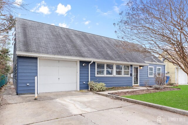 ranch-style house featuring a garage