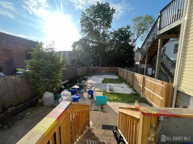 83 Throop Ave, New Brunswick, NJ 08901 - fenced backyard with a patio area and stairs