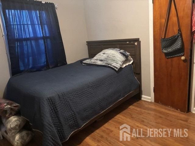 bedroom featuring hardwood / wood-style flooring