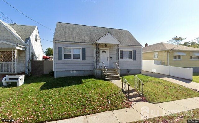 bungalow-style home featuring a front yard