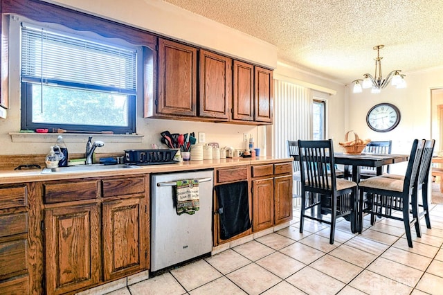 21 Wellington Ct, Sayreville, NJ 08872 - kitchen with dishwasher, brown cabinetry, a textured ceiling, healthy amount of natural light, and light countertops