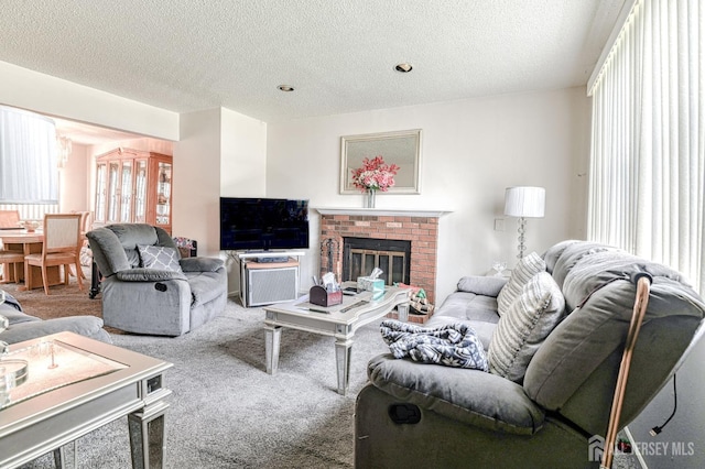 21 Wellington Ct, Sayreville, NJ 08872 - living room featuring a textured ceiling, carpet flooring, and a brick fireplace