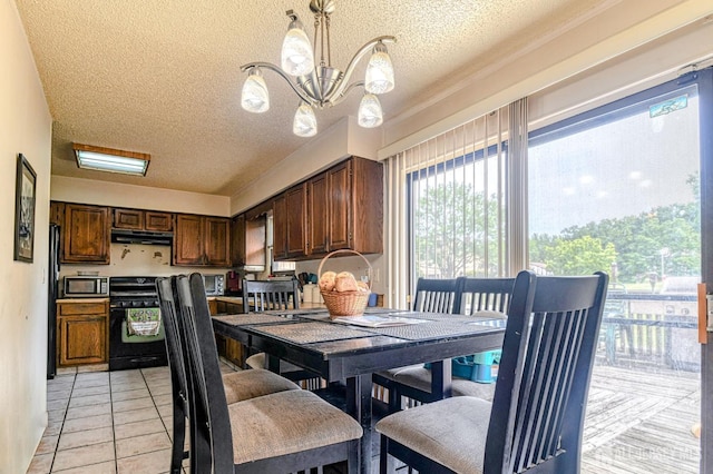 21 Wellington Ct, Sayreville, NJ 08872 - dining room with a textured ceiling, a chandelier, and light tile patterned floors