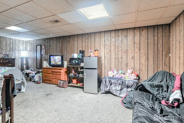 21 Wellington Ct, Sayreville, NJ 08872 - bedroom featuring freestanding refrigerator, carpet, wood walls, and a paneled ceiling