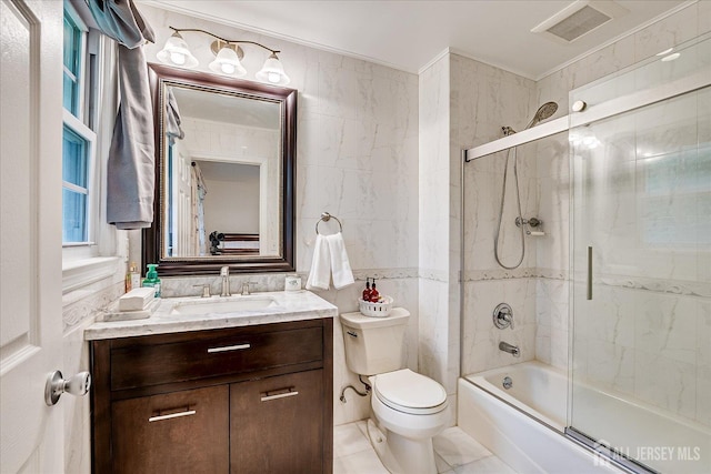10 Dellview Dr, Edison, NJ 08820 - bathroom with vanity, bath / shower combo with glass door, tile walls, and tile patterned flooring
