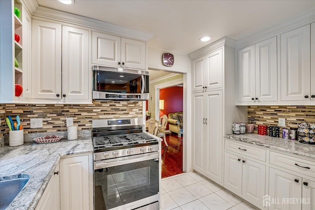10 Dellview Dr, Edison, NJ 08820 - kitchen featuring appliances with stainless steel finishes, white cabinetry, tasteful backsplash, recessed lighting, and light stone countertops