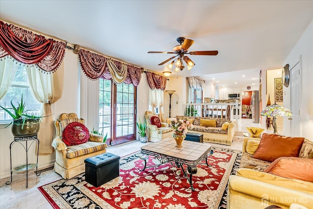 10 Dellview Dr, Edison, NJ 08820 - living area with a ceiling fan and baseboards