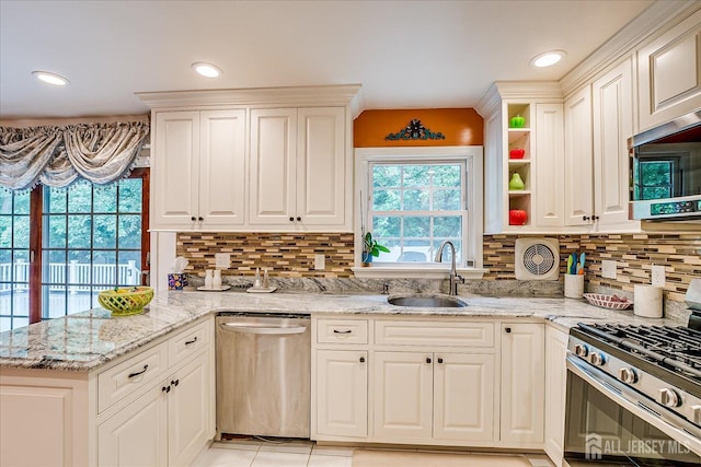 10 Dellview Dr, Edison, NJ 08820 - kitchen featuring stainless steel appliances, white cabinets, backsplash, light stone counters, and recessed lighting