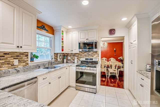 10 Dellview Dr, Edison, NJ 08820 - kitchen with stainless steel appliances, white cabinetry, light stone counters, tasteful backsplash, and recessed lighting