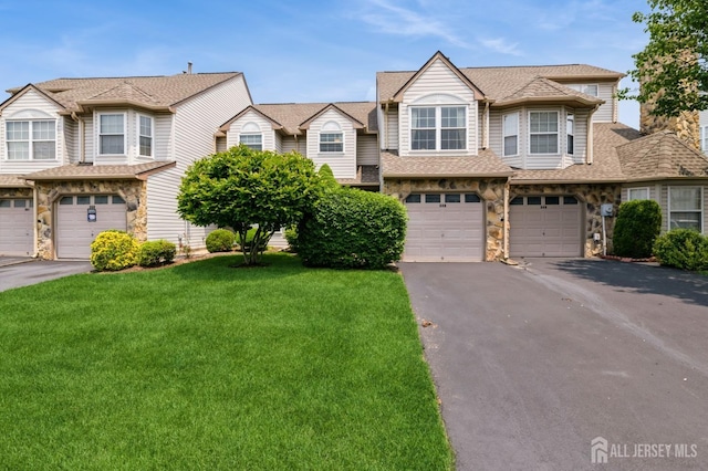 349 Lunar Rd, Piscataway, NJ 08854 - townhome / multi-family property featuring stone siding, driveway, and an attached garage