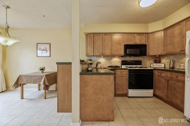 349 Lunar Rd, Piscataway, NJ 08854 - kitchen with black microwave, white gas range, dark countertops, a textured ceiling, and light tile patterned floors