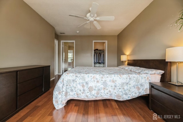 349 Lunar Rd, Piscataway, NJ 08854 - bedroom with dark wood-type flooring, a walk in closet, a closet, and ceiling fan