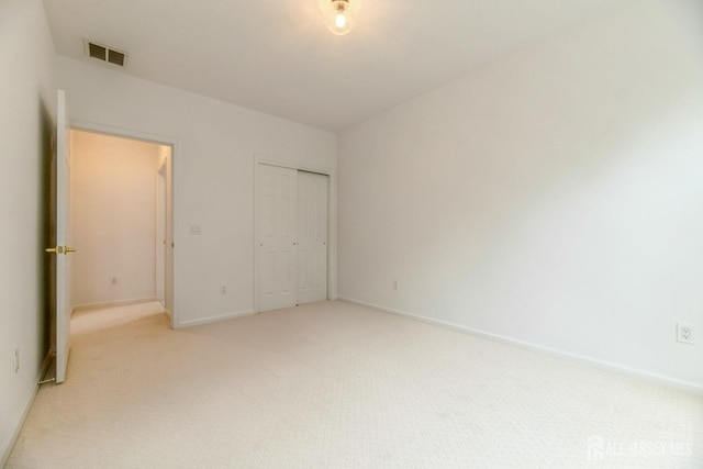 1109 Cedar Village Blvd, East Brunswick, NJ 08816 - unfurnished bedroom with light carpet, baseboards, and a closet