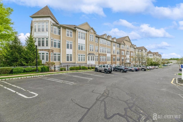 1109 Cedar Village Blvd, East Brunswick, NJ 08816 - view of property featuring uncovered parking