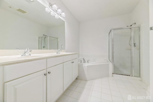 1109 Cedar Village Blvd, East Brunswick, NJ 08816 - full bathroom with tile patterned floors, a shower stall, a bath, and double vanity