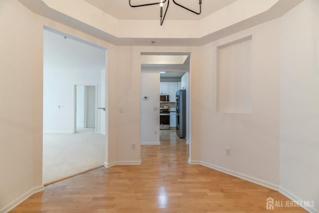 1109 Cedar Village Blvd, East Brunswick, NJ 08816 - corridor featuring light wood finished floors and baseboards