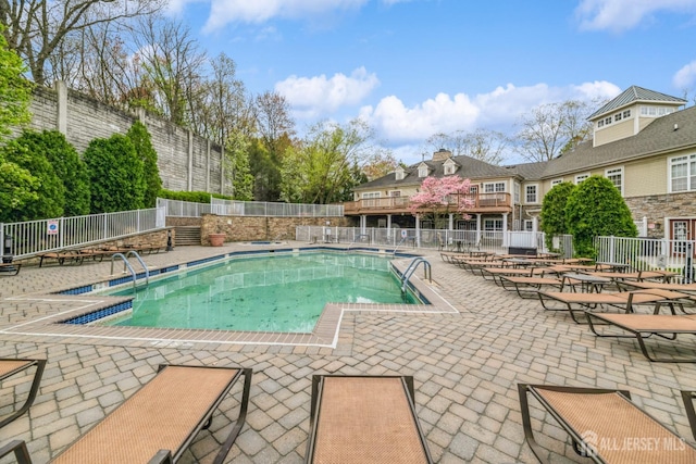 1109 Cedar Village Blvd, East Brunswick, NJ 08816 - community pool featuring fence and a patio area
