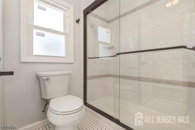 88 Roosevelt Ave, Old Bridge, NJ 08879 - full bathroom featuring baseboards, toilet, and a shower stall