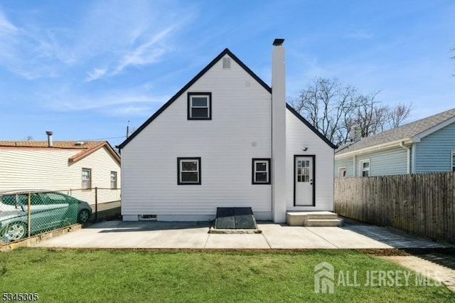 88 Roosevelt Ave, Old Bridge, NJ 08879 - back of property with a patio area and a chimney
