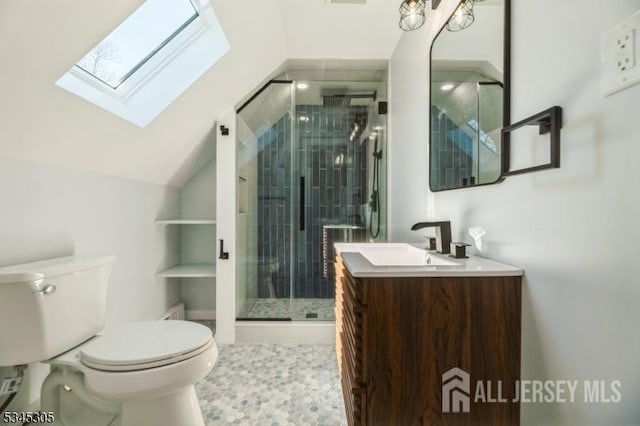 88 Roosevelt Ave, Old Bridge, NJ 08879 - full bathroom featuring toilet, a skylight, vanity, lofted ceiling, and a shower stall