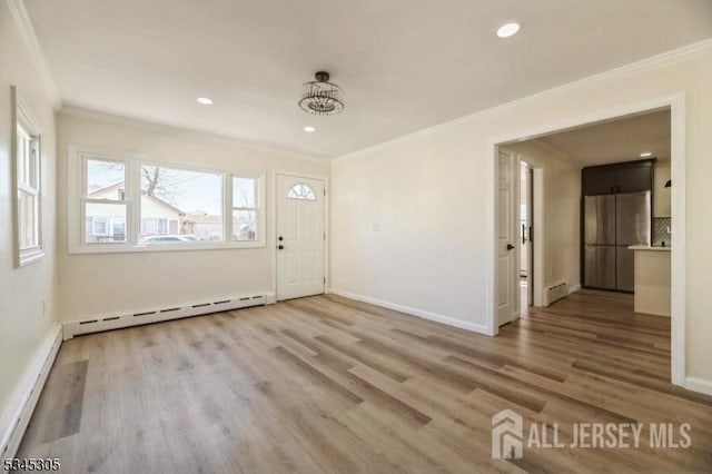 88 Roosevelt Ave, Old Bridge, NJ 08879 - entryway featuring crown molding, a baseboard radiator, wood finished floors, baseboards, and recessed lighting