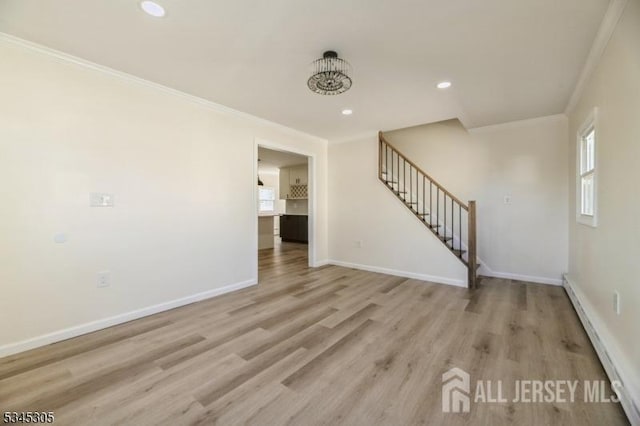 88 Roosevelt Ave, Old Bridge, NJ 08879 - unfurnished living room with ornamental molding, a baseboard heating unit, stairway, light wood finished floors, and baseboards
