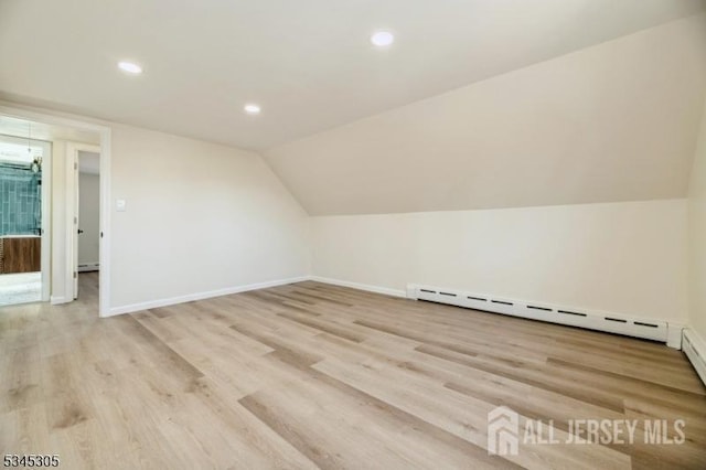 88 Roosevelt Ave, Old Bridge, NJ 08879 - bonus room with light wood-style flooring, recessed lighting, baseboards, baseboard heating, and vaulted ceiling