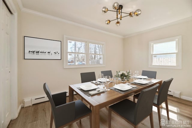 88 Roosevelt Ave, Old Bridge, NJ 08879 - dining space with a chandelier, light wood-type flooring, plenty of natural light, crown molding, and baseboards