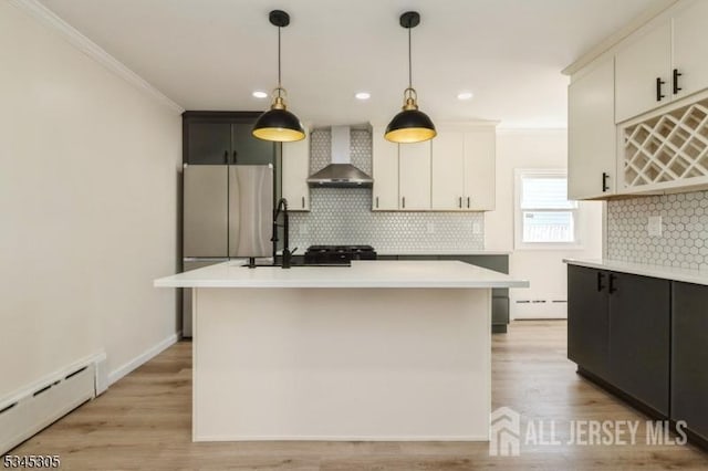 88 Roosevelt Ave, Old Bridge, NJ 08879 - kitchen featuring wall chimney exhaust hood, baseboard heating, ornamental molding, tasteful backsplash, and light countertops