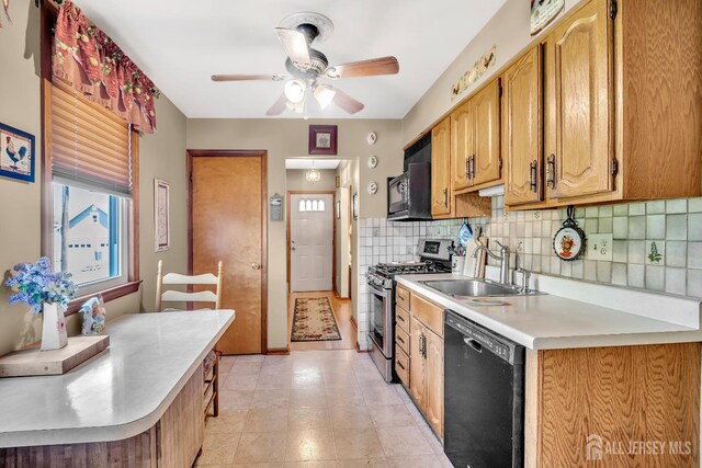 112 Adeline Ave, South Plainfield, NJ 07080 - kitchen featuring black appliances, light countertops, a ceiling fan, a sink, and tasteful backsplash