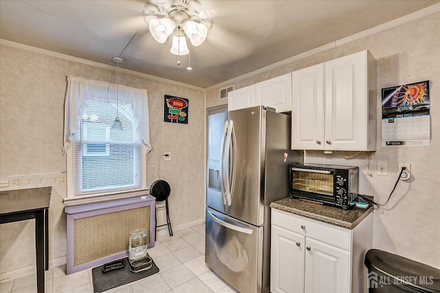12 Church St, Sayreville, NJ 08872 - kitchen with stainless steel fridge, ornamental molding, a ceiling fan, white cabinets, and light tile patterned floors