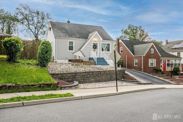 12 Church St, Sayreville, NJ 08872 - view of front facade featuring a chimney and roof with shingles