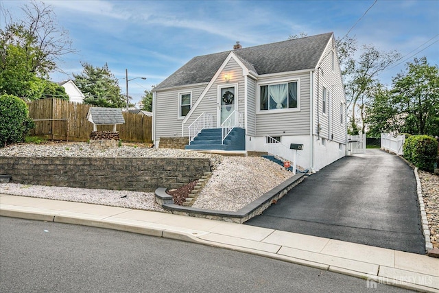12 Church St, Sayreville, NJ 08872 - bungalow-style home with a chimney, roof with shingles, and asphalt driveway