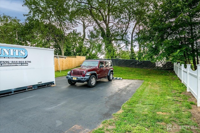 12 Church St, Sayreville, NJ 08872 - uncovered parking lot featuring a fenced backyard